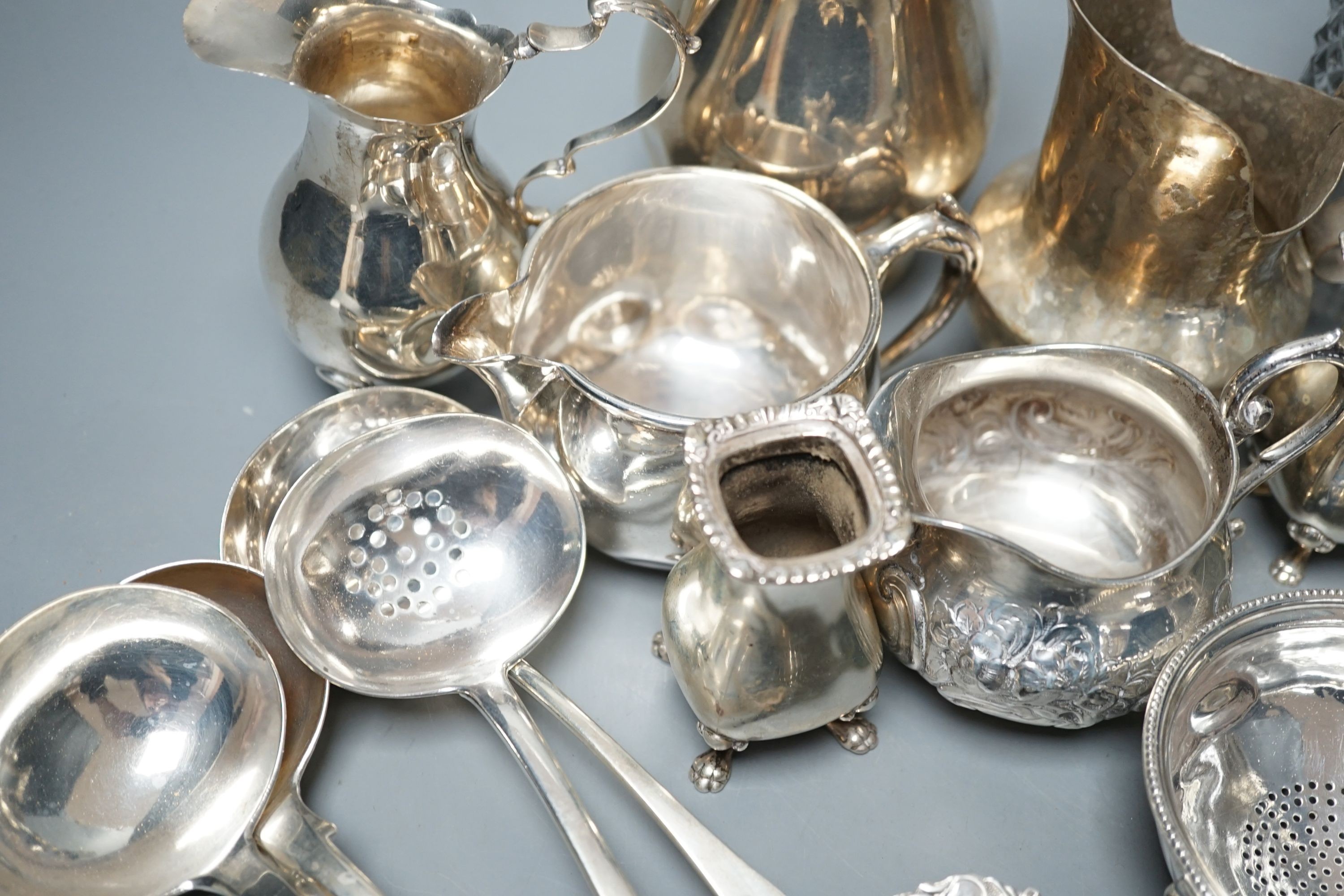 A mixed collection of small silver and sterling items, to include five assorted small ladles, cream jugs, Georgian mustard, bowls etc.